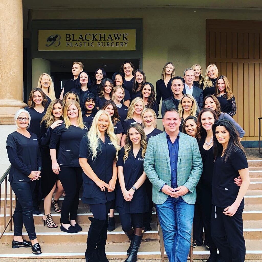 Blackhawk Plastic Surgery team posing outside office entrance in Danville, California