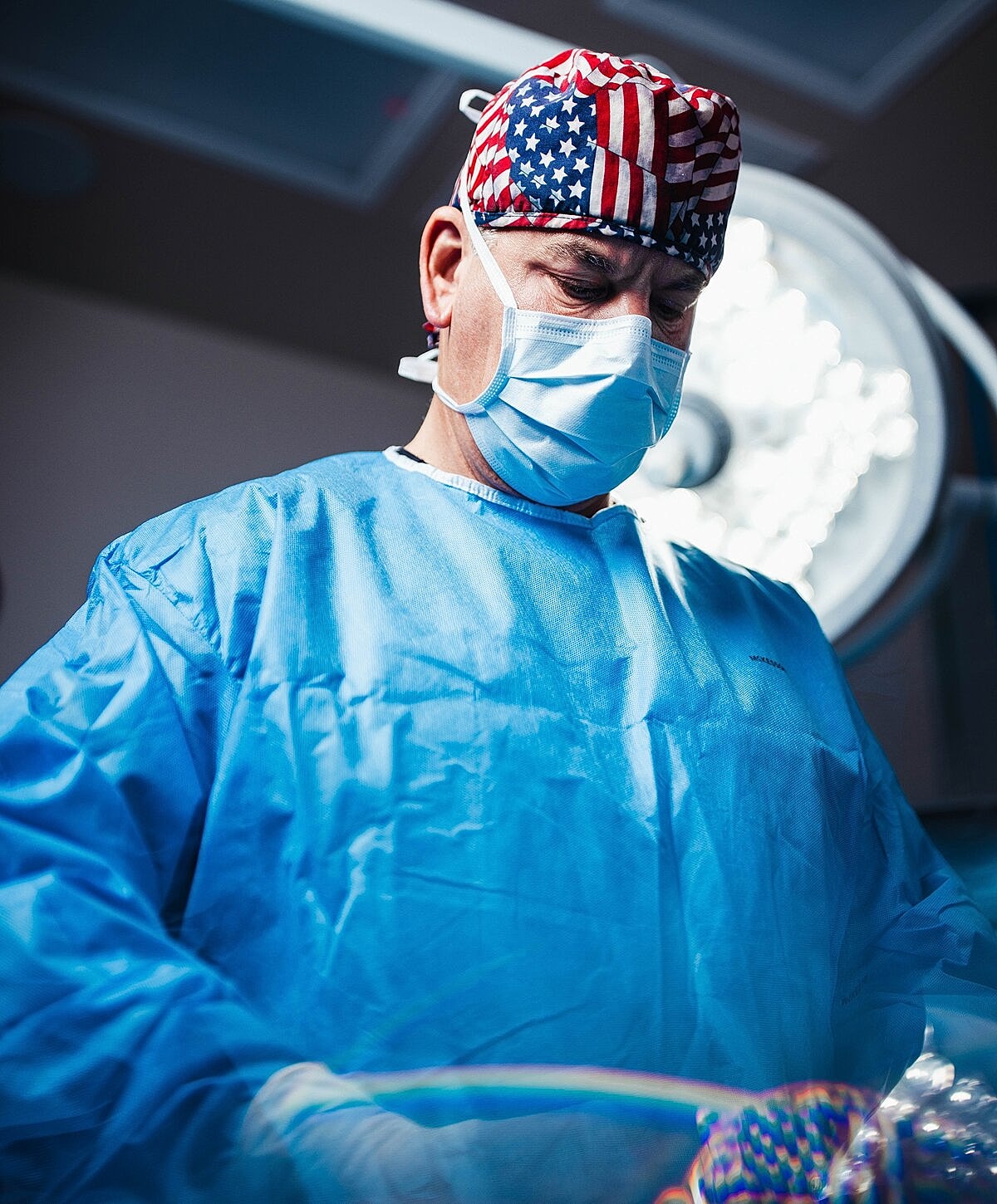 Surgeon in scrubs preparing for surgery.