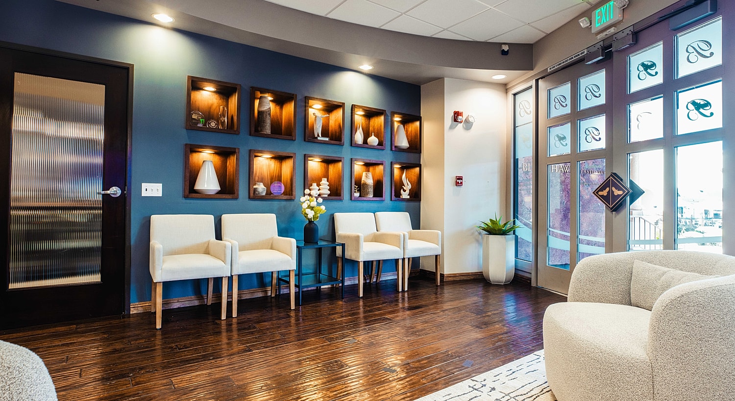 Modern waiting area with decorative shelves.
