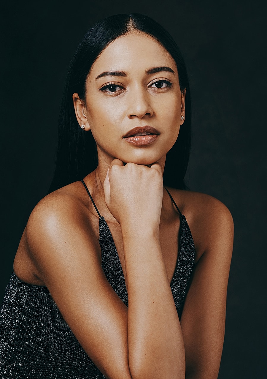 Woman with short hair and natural makeup.