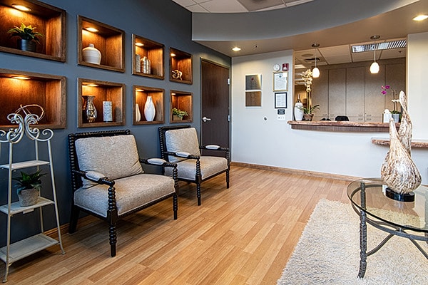 Blackhawk Plastic Surgery & MedSpa modern waiting room with upholstered chairs and reception desk