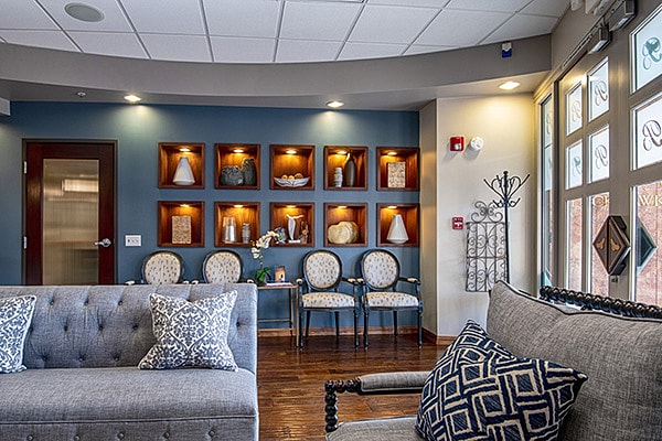 Blackhawk Plastic Surgery waiting room with comfortable seating and illuminated skincare product display