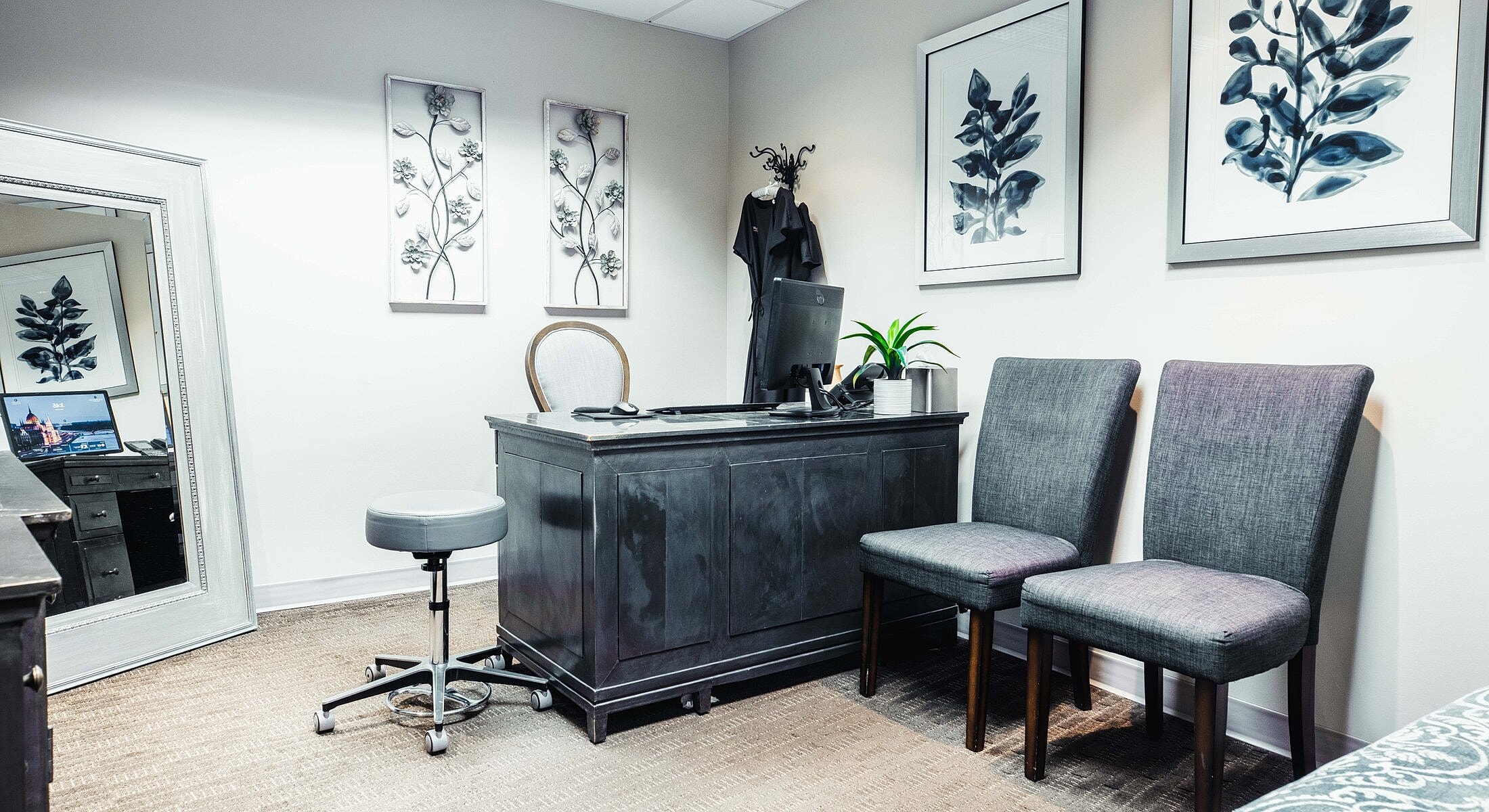 Modern office space with decorative plants and furniture.