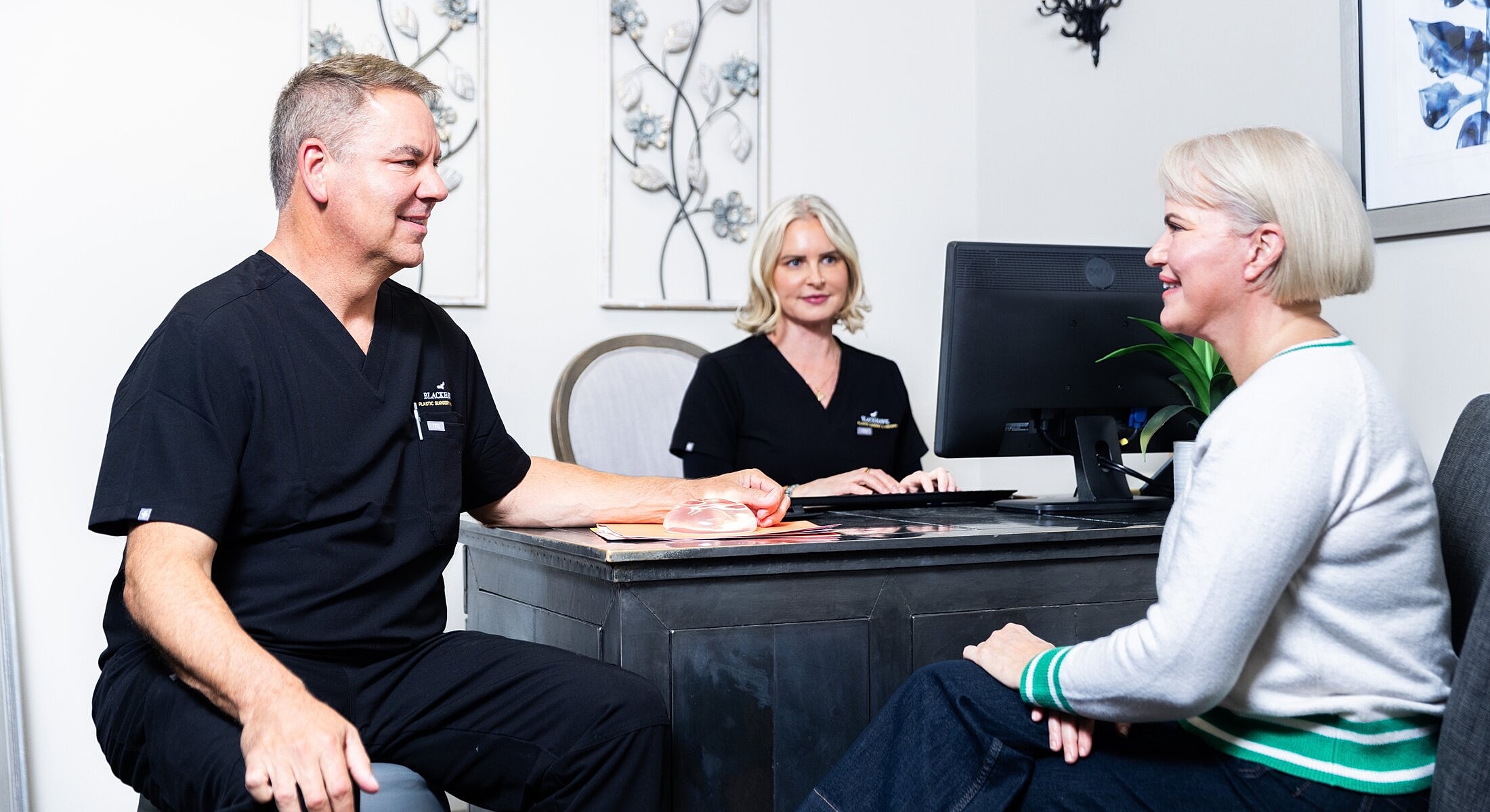 Patients consulting with medical professionals in office.