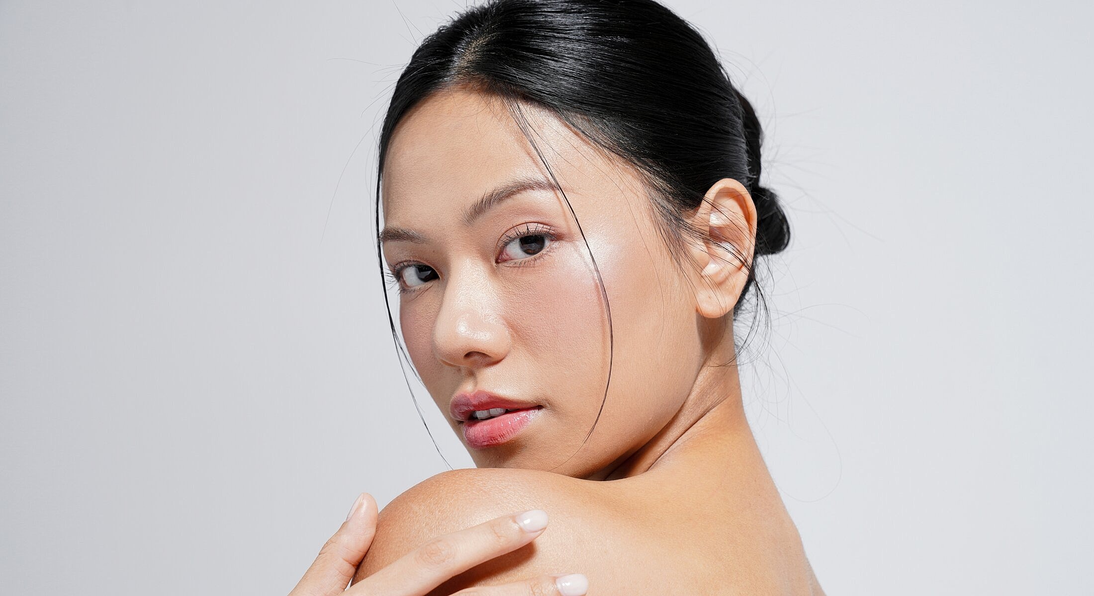 Portrait of a woman with sleek hair.